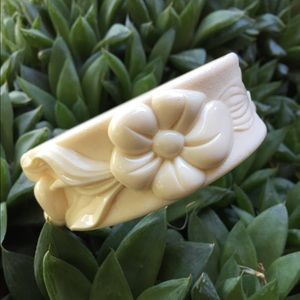 Carved plastic flower bangle bracelet